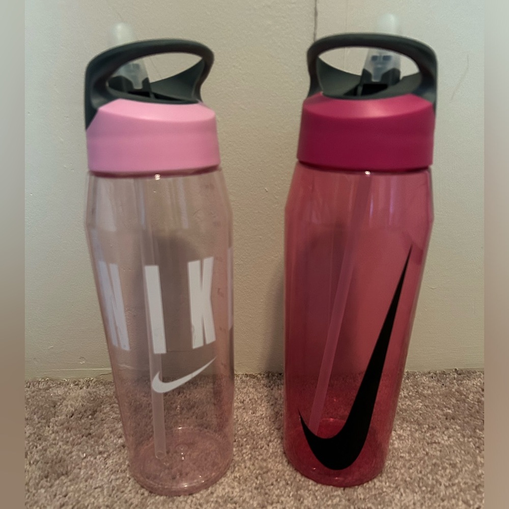 Pair of Nike water bottles